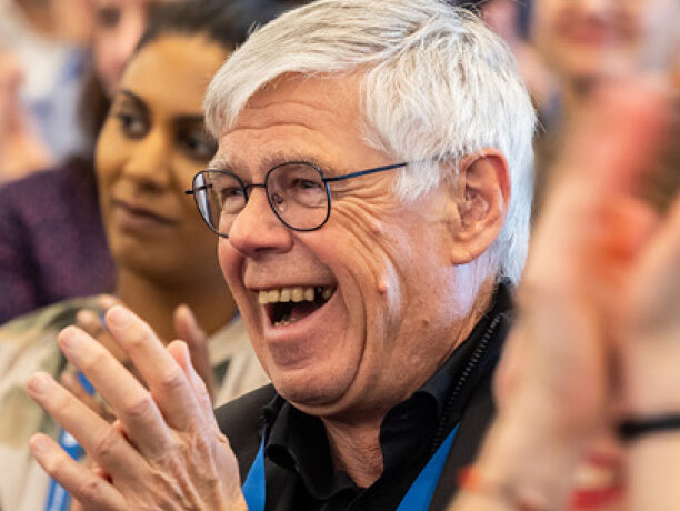 picture man laughing audience