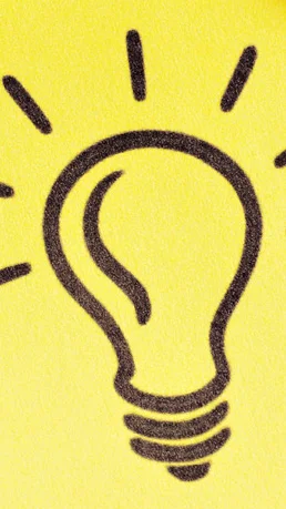 Notizzettel mit Glühbirne welcher als Idee dienen soll