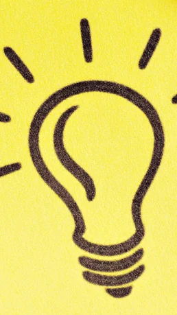 Notizzettel mit Glühbirne welcher als Idee dienen soll