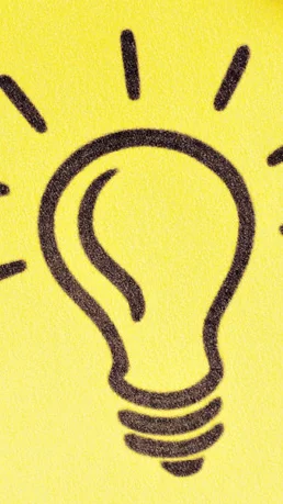 Notizzettel mit Glühbirne welcher als Idee dienen soll