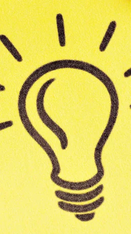 Notizzettel mit Glühbirne welcher als Idee dienen soll