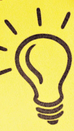 Notizzettel mit Glühbirne welcher als Idee dienen soll
