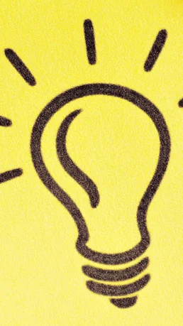 Notizzettel mit Glühbirne welcher als Idee dienen soll
